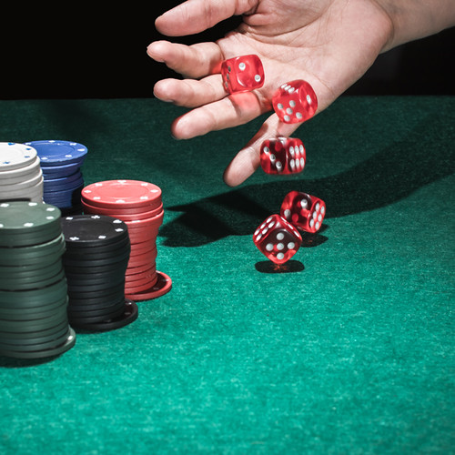 human-hand-rolling-several-red-dices-casino_23-2147881432